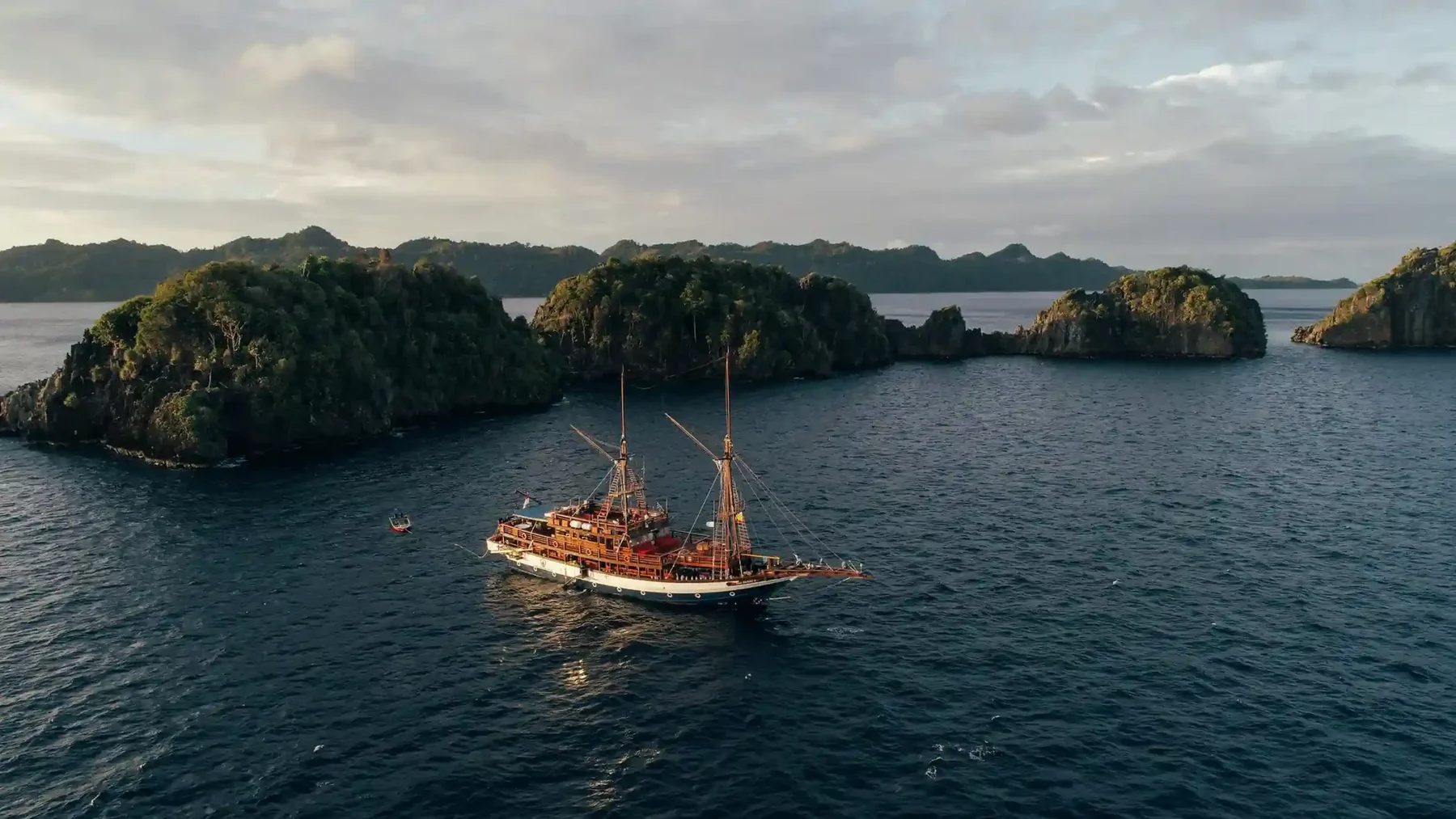 Chartering Raja Ampat in 2026: Seasons, Permits, and Which Boat Type Fits